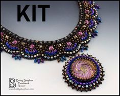 the beaded necklace and earring kit is designed to look like an intricate piece of art