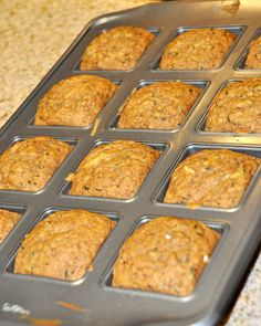 freshly baked muffins sitting in a pan on the counter