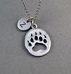 Bear Paw Print Necklace w/ Initial by ShortandBaldJewelry, via Etsy Personalized Silver Jewelry With Paw Print, Silver Paw Print Jewelry For Personalized Gift, Silver Jewelry With Paw Print For Personalized Gift, Shiny Trinkets, Bear Paw Print, Pawprint Tattoo, Paw Necklace, Paw Print Necklace, Paw Print Charm