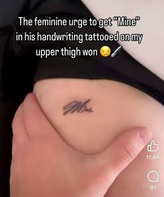 a woman's stomach with a tattoo saying the feminine urge to get mine in his handwriting tattooed on my upper thigh won