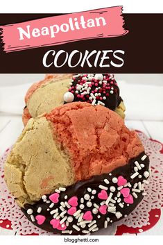 a close up of some cookies on a plate with sprinkles and hearts