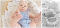 a baby laying in a basket next to an infant's hand and the photo is black and white