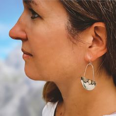 You will love these mixed metal, high-contrast mountain, and moon earrings. The moon is 14K gold and really pops against the black silver in the night sky. The mountains are very contemporary without any texture and the black-silver sky adds a beautiful contrast to the gold and tarnish-resistant Argentium sterling silver. Details: length- approximately 1 1/4” wide x 1 5/8” long Material(s)- solid Argentium sterling silver and 14K gold Argentium sterling silver French ear wire (Argentium is also Modern Silver Semi-circle Jewelry, Nickel Free Silver Fusion Earrings, Nickel-free Silver Fusion Earrings, Elegant Silver Moon-shaped Jewelry, Elegant Silver Moon Jewelry, Elegant Moon Phase Earrings, Elegant Semi-circle Metal Earrings, Elegant Moon-shaped Metal Earrings, Elegant Moon Shaped Metal Earrings