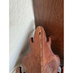 an old wooden shelf with some wood in it