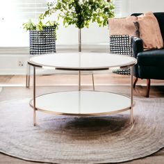 a living room with two couches and a coffee table in the middle of it