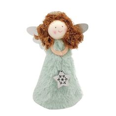 a green and white stuffed angel with red hair on it's head, holding a star