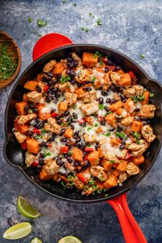 a skillet filled with mexican chicken and black beans