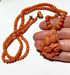 "this is an authentic Victorian not dyed RICH saturated in color SALMON coral carved 3D BIG carved pendant necklace in great condition. it is substantial approx 30\" from end to end and approx 44g! the biggest bead is approx 8mm and the smallest approx 4mm! the pendant is really big and approx 34x36mmx14mm deep at widest points! the clasp is aprrox sterling silver or less purity. has a hallmark - please see photo. small % of the beads have natural pits, but no cracks to the beads or pendant! cla Run The Jewels, Carved Pendant, Coral Bracelet, Coral Jewelry, Antique Necklace, African Jewelry, Coral Turquoise, Gold Design, Live Lokai Bracelet