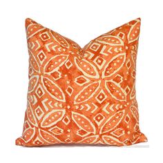 an orange and white pillow on a white background