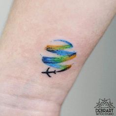 a small tattoo with an airplane painted on it