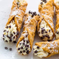 chocolate chip crepes with cream and chocolate chips on top are ready to be eaten