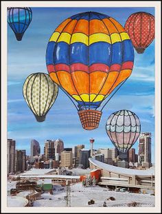 hot air balloons in the sky over a cityscape with buildings and snow on the ground