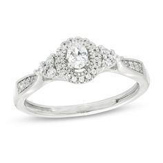 All your wonderful moments shine through this vintage-inspired diamond engagement ring. Created in cool 10K white gold, this romantic style features a 1/6 ct. oval-shaped diamond wrapped in a frame of diamonds and intricate milgrain detailing. Trios of diamonds flank the center while graduated-size diamonds glisten between milgrain borders along the pinched shank. Radiant with 1/3 ct. t.w. of diamonds and a brilliant buffed luster, this engagement ring captures the beauty of your love. Zales Engagement Rings, Vintage Style Engagement Rings, Diamond Frame, Gold Price, Romantic Style, Oval Diamond, Engagement Ring Settings, Diamond Stone, Diamond Engagement Ring