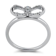 Top of ring height: 9mm

         Top of ring width: 15.5mm

      Band width:  1.7mm

      Shank width: 1.5mm

    
        Stone material:  clear cubic zirconia  

      Stone shape:  round

      Total number of CZ    stones: 16

      Stone setting:  channel setting

   
       Metal:  925 sterling silver

      Plating:  rhodium plated    (what is rhodium?) What is Rhodium? 
 
   If you're not familiar with Rhodium, it's a rare metal in the platinum   group, and at over $20,000 per KG, it' Ribbon Ring, Fake Jewelry, Channel Setting, Stone Material, Stone Setting, Lovely Ring, Cz Ring, Pretty Rings, Rings Simple