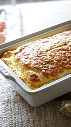 a casserole dish with bread in it on a table