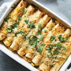 a casserole dish with chicken, cheese and cilantro garnish