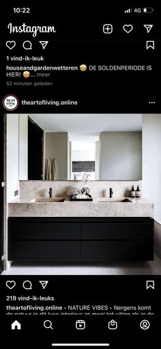 an image of a bathroom with two sinks and mirrors on the front of the photo