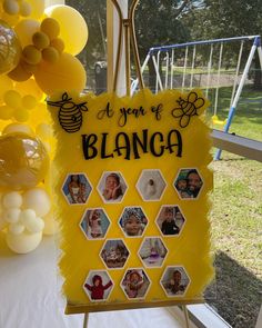 a sign that says it's your blanea with pictures on it and balloons in the background