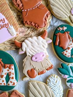 some decorated cookies are laying on a table