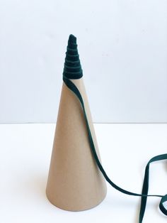 a cone shaped object with a cord attached to it