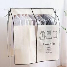 an over - the - door garment rack holds clothes