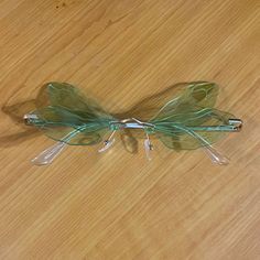 a piece of glass sitting on top of a wooden table