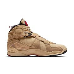 A look at the Nike Air Jordan 8 Retro SE reveals a sneaker that is both stylish and comfortable. This shoe was designed for NBA athlete Rui Hachimura and features a tan suede upper with perforated detailing and tonal patterned overlays. The 8's signature details remain intact, including the unique cross-strap design, printed mudguard, and chenille tongue patch, updated here in red with Rui's personal logo. The sneaker rides on a matching tan polyurethane midsole with encapsulated Nike Air cushioning in the forefoot and heel, providing superior comfort whether you're on the court or just running around town. So grab a pair of these stylish and comfortable sneakers today. High-top Basketball Shoes With Vibram Sole For Streetwear, Urban Leather Sneakers With Red Sole, Casual Basketball Shoes For Streetwear, Outdoor Sneakers With Red Sole And Round Toe, Functional Sneakers With Red Sole For Streetwear, Outdoor Leather Basketball Shoes With Rubber Sole, Leather Moc Toe Sneakers For Streetwear, Brown High-top Custom Sneakers With Vibram Sole, Modern Leather Jordan Shoes For Streetwear