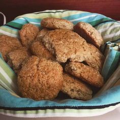 a bowl filled with cookies sitting on top of a table