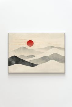 a painting hanging on the wall in front of a white wall with a red sun