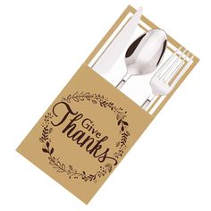 a fork, spoon and card with the words give thanks written on it