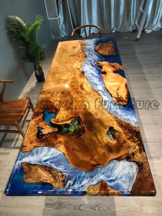 a table that has been made to look like an ocean scene with rocks and water on it