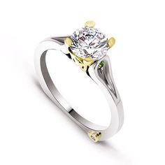 a white and yellow gold ring with a diamond