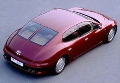 a red sports car is parked on the street