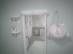 a baby's room is decorated in pink and white