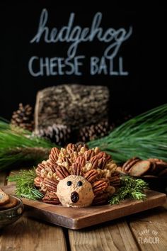 a hedge ball made out of nuts and pine cones on top of a wooden table