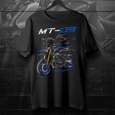 a black t - shirt with the image of a motorcycle on it