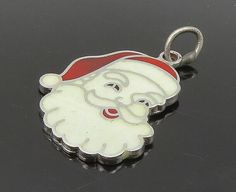 925 Sterling Silver - Vintage Enamel Santa Clause Christmas Pendant - PT12518  925 Sterling Silver - Vintage Enamel Santa Clause Christmas Pendant - PT12518  Jewelry Type:         Pendant   Metal Type:            925 Silver  Metal Size:             1"  Stone Type:            N/A  Condition:              N/A  Jewelry Weight:     3.1 Grams  PLEASE NOTE: THIS ITEM IS PRE-OWNED. ALTHOUGH MOST ITEMS ARE IN VERY GOOD CONDITION, SOME MAY NEED CLEANING AND/OR MINOR REPAIRS. WE MAKE A VERY STRONG EFFORT Christmas Pendant, Santa Clause, Types Of Metal, Santa Claus, Metallic Silver, 925 Silver, 925 Sterling Silver, Sterling Silver, Stone