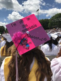 a pink and purple graduation cap that says i'm off this entratable adventure