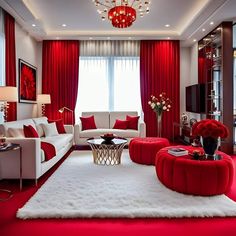 a living room with red curtains, white furniture and a chandelier hanging from the ceiling