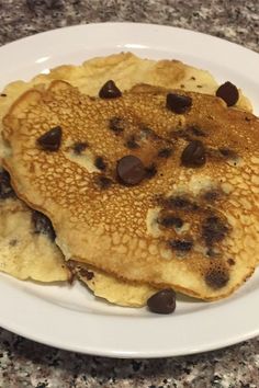 pancakes with chocolate chips on a white plate