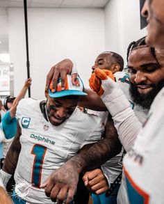 the miami dolphins players are getting ready to go on their team's football game