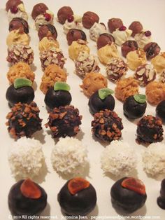 an assortment of chocolates and nuts arranged in rows