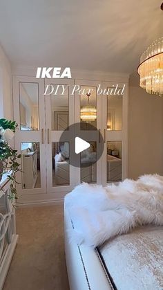 a bed room with a neatly made bed and a chandelier