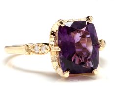 3.38 Carats Natural Amethyst and Diamond 14K Solid Yellow Gold Ring Suggested Replacement Value: $2,900.00 Total Natural Cushion Shaped Amethyst Weights: Approx. 3.30 Carats Amethyst Measures: Approx. 10 x 8mm Natural Round Diamonds Weight: Approx. 0.08 Carats (color G-H / Clarity SI1-SI2) Ring total weight: Approx. 4.0 grams Disclaimer: all weights, measurements and colors are approximate and may vary slightly from the listed dimensions or as seen in the image. All pictures are magnified to sho Elegant Amethyst Diamond Ring With Gemstone Accents, Classic Wedding Amethyst Ring With Gemstone Accents, Elegant Purple Diamond Ring With Gemstone Accents, Elegant Cushion Cut Yellow Gold Amethyst Ring, Exquisite Yellow Gold Amethyst Ring With Accent Stones, Elegant Yellow Gold Amethyst Ring With Diamond Accents, Elegant Purple Amethyst Ring With Accent Stones, Luxury Amethyst Cushion Cut Ring For Formal Occasions, Luxury Amethyst Cushion Cut Ring For Formal Events