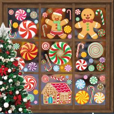 a christmas window decorated with gingerbreads and candy canes