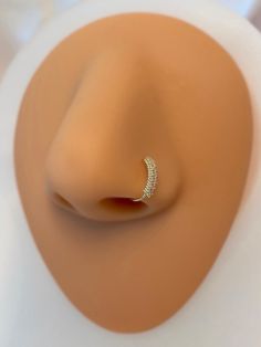 a close up view of a ring on a mannequin's head