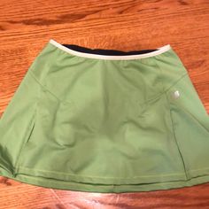 New Balance Shorts/Skort. Excellent Condition. Never Worn Sporty Green Mini Skirt For Sports, Green Mini Tennis Skirt With Built-in Shorts, Sporty Green Skort With Short Inseam, Sporty Green Mini Skirt With Built-in Shorts, Casual Green Skort For Sports, Casual Green Sports Skirt, Casual Green Tennis Skirt With Built-in Shorts, Green Skort With Built-in Shorts, Sporty Green Short Length Skort