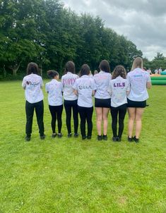 a group of girls standing in a circle