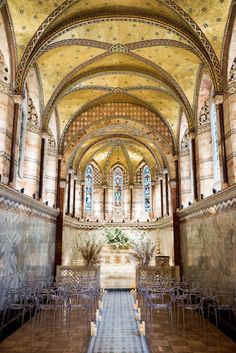 the inside of a church with rows of chairs