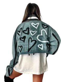 DESCRIPTION Crop style denim jacket with extra long, baggy sleeves. Black and white hearts painted all around the body of the jacket, with black stripes painted down the sleeve. Signed @wrenandglory. Due to each piece being hand painted, each jacket might have slight differences. Please allow 1-2 weeks delivery, as each jacket is hand painted, and made to order. Limited Edition! EACH PIECE IS MADE TO ORDER, HAND PAINTED BY GLORIA AND HER TEAM IN THEIR NYC STUDIO FIT The perfect crop denim Soft a Trendy Winter Outerwear With Heart Print, Casual Long Sleeve Heart Print Outerwear, Casual Heart Print Outerwear For Spring, Casual Spring Outerwear With Heart Print, Baggy Sleeves, Style Denim Jacket, Nyc Studio, Painted Denim Jacket, Black And White Heart